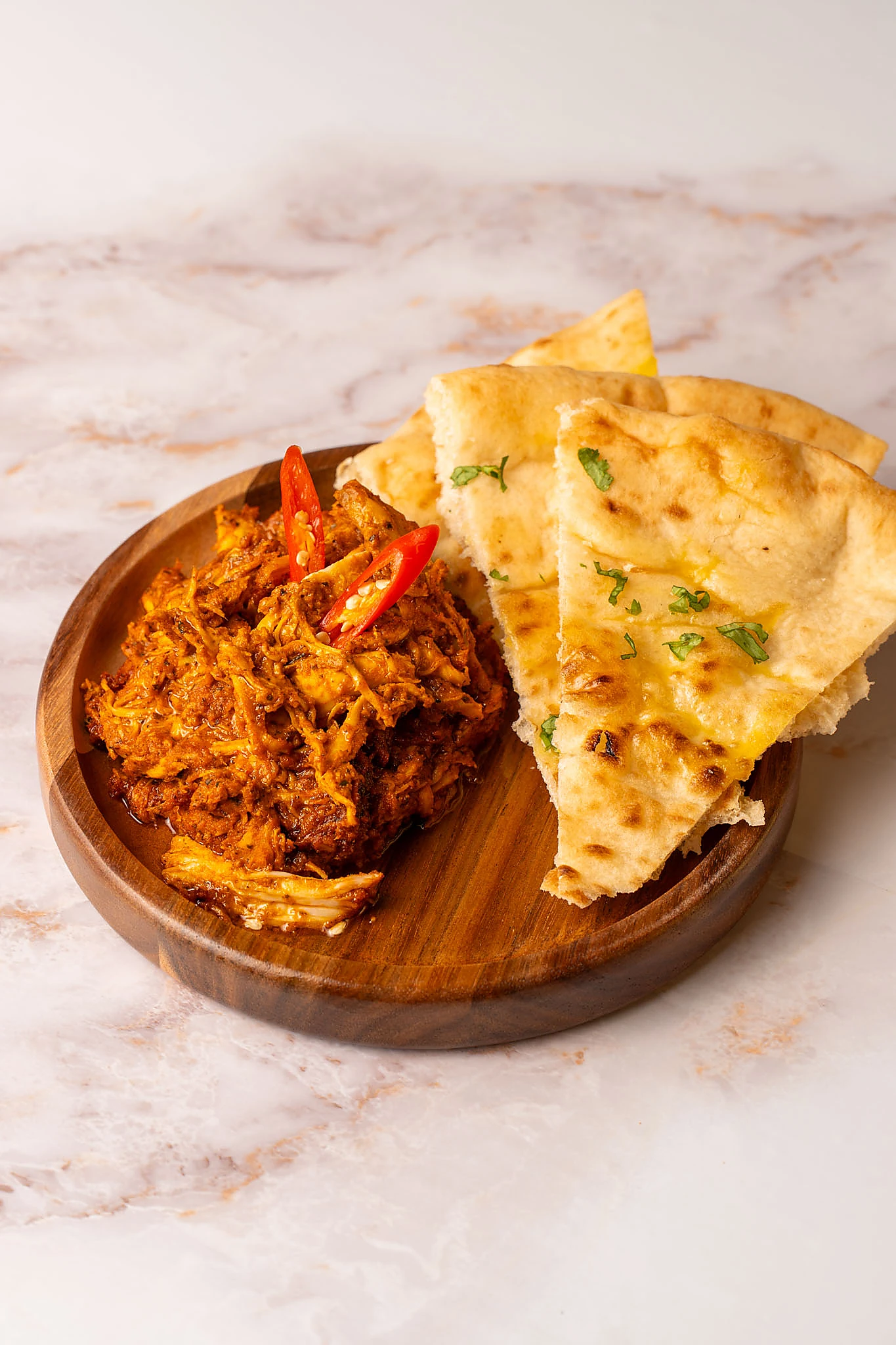 Richly spiced bunna chicken with naan
