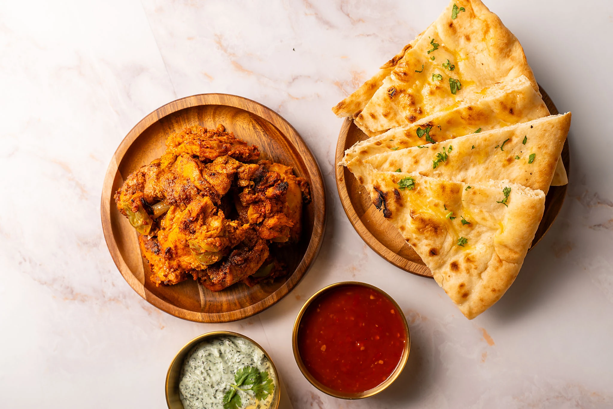 Chicken tikka biryani plated with accompaniments