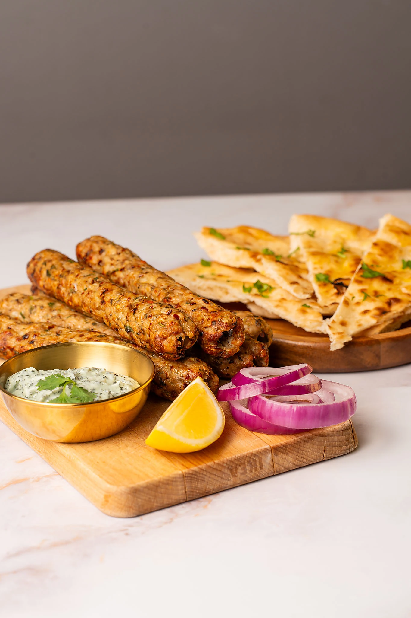 Chicken seekh kebabs served with naan and salad